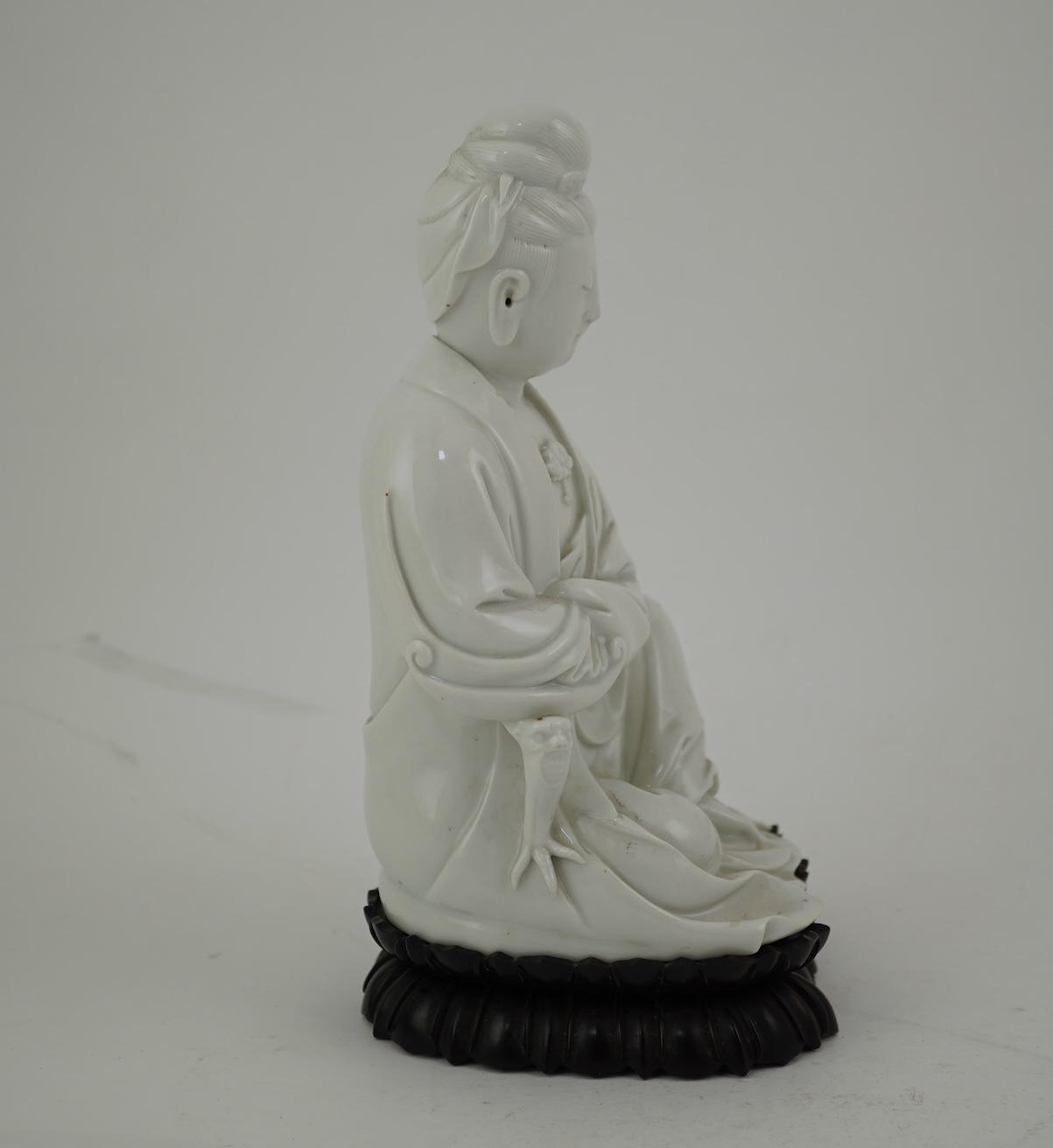 A Chinese blanc-de-chine seated figure of Guanyin, late 19th/early 20th century